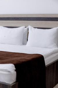 Postel nebo postele na pokoji v ubytování INFINITY PLAZA BLOCK 1