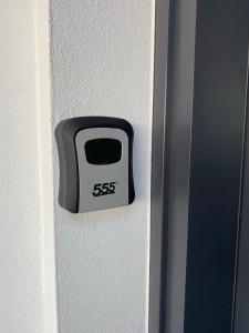a clock on the side of a door at Blue Deja Blue Seaside Appartments in Bahçeli