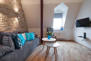 Televízia a/alebo spoločenská miestnosť v ubytovaní Neo Apartments