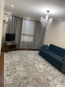 TV a/nebo společenská místnost v ubytování Apartment Rudaki-94