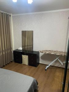 Postel nebo postele na pokoji v ubytování Apartment Rudaki-94
