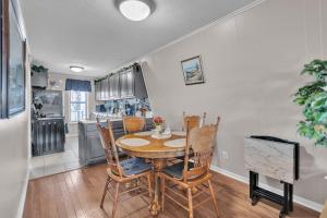 a kitchen and dining room with a table and chairs at Beautiful Lakeview Chateau with Stunning Views home in Rutledge