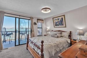a bedroom with a bed with a view of the ocean at Beautiful Lakeview Chateau with Stunning Views home in Rutledge