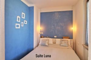 Posteľ alebo postele v izbe v ubytovaní APPARTAMENTO di Charme SUITE LUNA