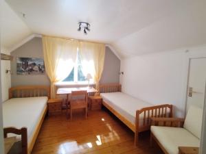 Postel nebo postele na pokoji v ubytování Morsgården