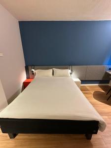 Postel nebo postele na pokoji v ubytování Ibis Roma Fiera