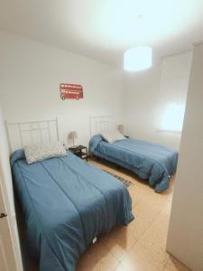 Posteľ alebo postele v izbe v ubytovaní Apartamento duplex vacacional
