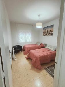 Posteľ alebo postele v izbe v ubytovaní Apartamento duplex vacacional