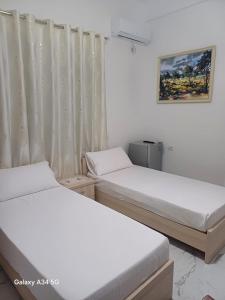 Postel nebo postele na pokoji v ubytování Hotel Sherifaj