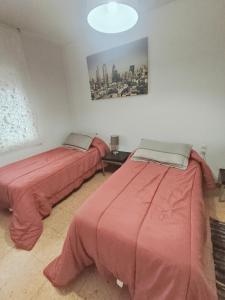 Posteľ alebo postele v izbe v ubytovaní Apartamento duplex vacacional