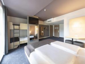 Postel nebo postele na pokoji v ubytování B&B HOTEL Gera