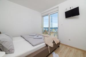 Postel nebo postele na pokoji v ubytování Apartments Jozic + 65 fotografií