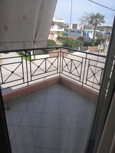 a balcony with a view of the ocean at Rosemary apartment in Eretria
