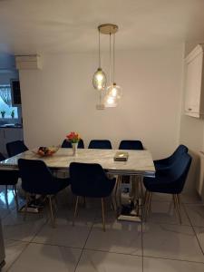 a dining room with a table and chairs at High Street House WEST BROMWICH in West Bromwich