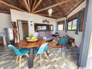 a living room with a table and chairs at Karibokite in Diego Suarez +27 photos