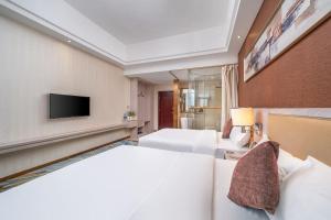 Penguin international hotel Baiyun Airport & C-harge shuttle bus for the Canton fair from April 15-May 5客房内的一张或多张床位