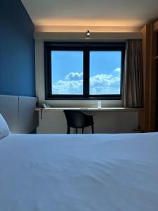 Postel nebo postele na pokoji v ubytování Ibis Roma Fiera