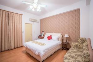 Postel nebo postele na pokoji v ubytování Hualien Travel