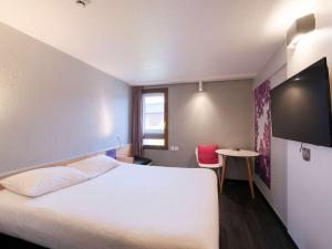 Postel nebo postele na pokoji v ubytování ibis Strasbourg Sud La Vigie