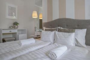 Postel nebo postele na pokoji v ubytování Vénusz Hotel
