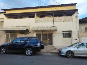 a black car parked in front of a building at Pousada Canto dos Pássaros in Montes Claros
