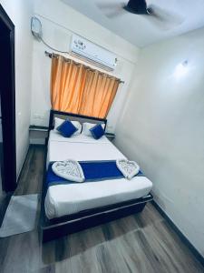 Postel nebo postele na pokoji v ubytování SM Rooms HSR Layout Bengaluru