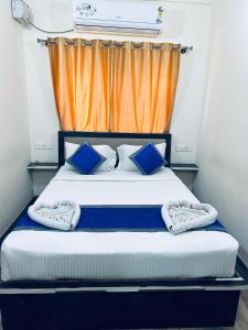 Postel nebo postele na pokoji v ubytování SM Rooms HSR Layout Bengaluru