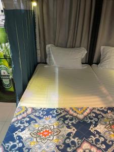 Postel nebo postele na pokoji v ubytování Friendly House Homestay