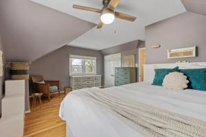 a bedroom with a bed and a ceiling fan at ALX Cape Cod 3-BR Near Old Town & Mount Vernon in Alexandria