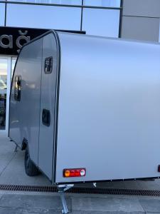 a food truck parked in front of a building at Caravan suit in Bitlis