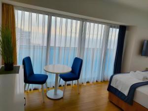 Postel nebo postele na pokoji v ubytování PANORAMA HOTEL SEA VIEW BATUMi