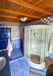 a bathroom with a shower with a glass door at Vicia in O Vicedo +17 photos