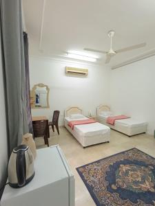 A bed or beds in a room at Leyla Hostel