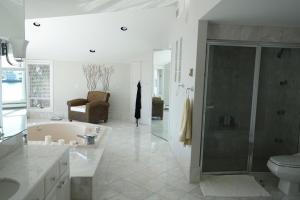 a bathroom with a tub and a shower and a toilet at Stunning, Large, Waterfront Retreat in Highlands +68 photos