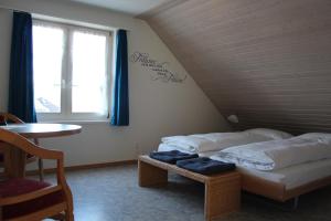 Postelja oz. postelje v sobi nastanitve Wirtshaus Rütihof