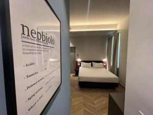 Postel nebo postele na pokoji v ubytování Hotel RossoVino Milano