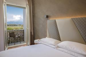 Postel nebo postele na pokoji v ubytování Hotel Tirreno