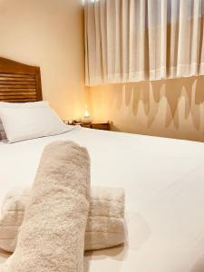 Postel nebo postele na pokoji v ubytování Nastasi Hotel & Spa