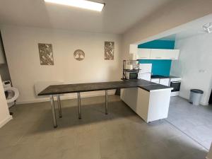 a kitchen with a counter top in a room at Les embruns IV in Saint-Jean-de-Monts