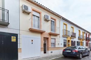 a car parked in front of a building at Casa López in Baena