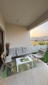 Χώρος καθιστικού στο Sifah Stay