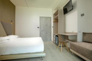 Postel nebo postele na pokoji v ubytování Hotel Tirreno