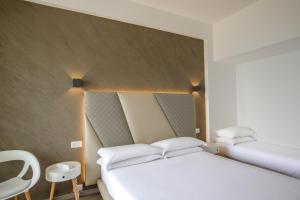 Postel nebo postele na pokoji v ubytování Hotel Tirreno