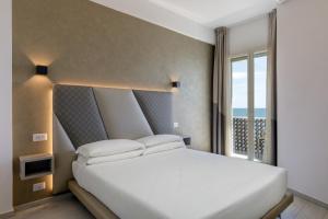 Postel nebo postele na pokoji v ubytování Hotel Tirreno