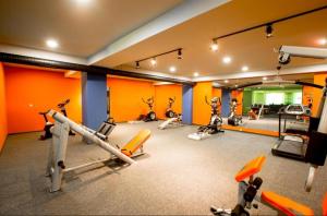 a gym with several exercise equipment in a room at Bakuriani, crystal residence 405 room in Bakuriani