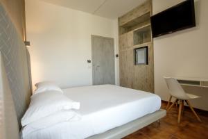 Postel nebo postele na pokoji v ubytování Hotel Tirreno