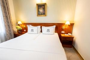 Posteľ alebo postele v izbe v ubytovaní Hotel Waldinger