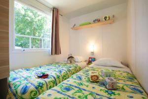 Postel nebo postele na pokoji v ubytování Camping Neptuno + 37 fotografií