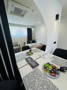 a room with a table with two plates of food on it at Golden Soul Sarajevo Old town - Walk everywhere in Sarajevo