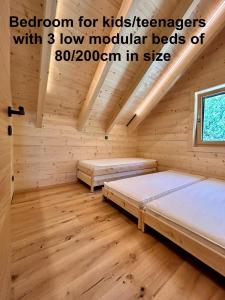 Postel nebo postele na pokoji v ubytování Das Grünhaus - Dein Chalet in Grünau im Almtal
